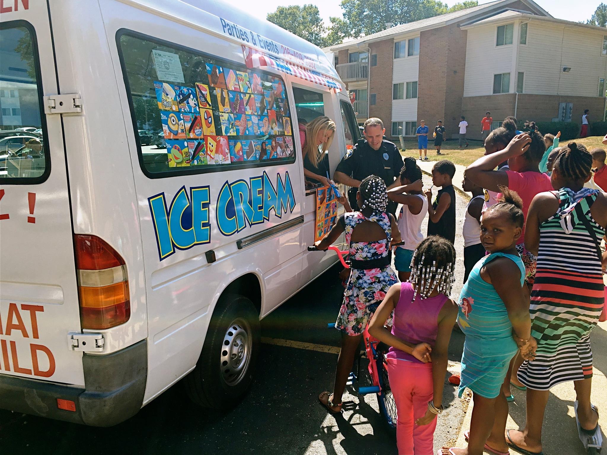 Ice cream truck serving kids