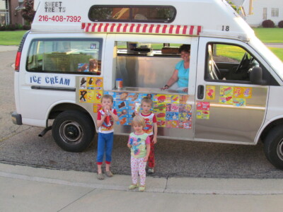 Ice cream truck serving kids
